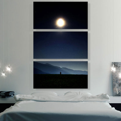 Man Standing Looking at Bright Moon in the Night