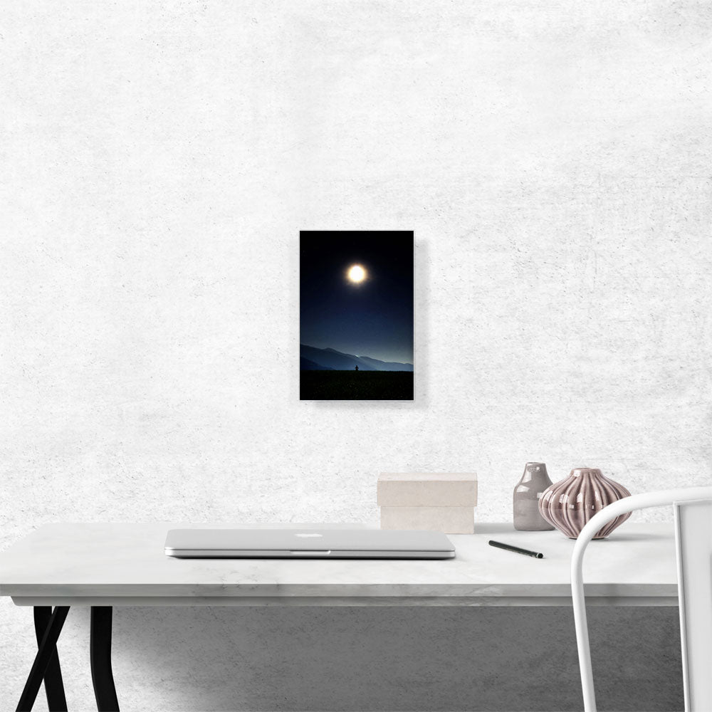 Man Standing Looking at Bright Moon in the Night